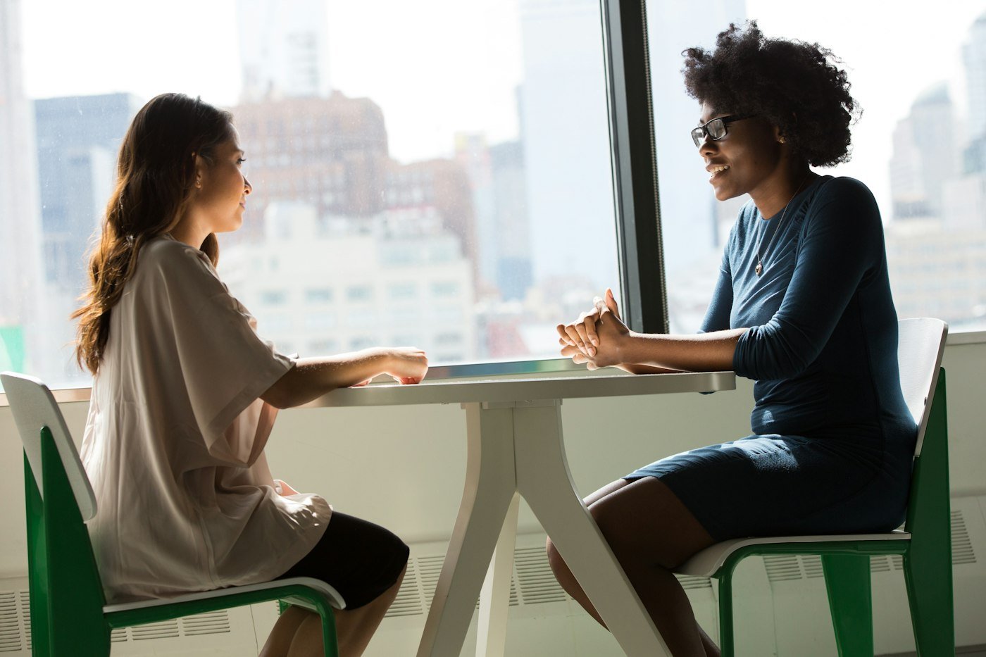 Two professionals in a legal consultation at an office table